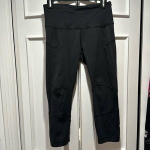 Lululemon black cropped tights. Likely a size 2 or 4.